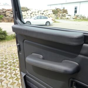 Arm rest at door cover left side, leather black